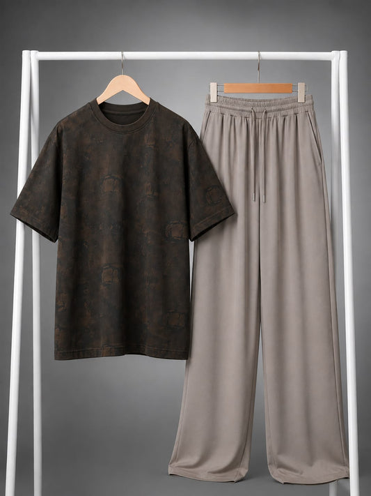 A two-piece casual outfit set consisting of a dark brown short-sleeve t-shirt with a subtle tonal pattern and matching light gray wide-leg drawstring pants, displayed on a white clothing rack.
